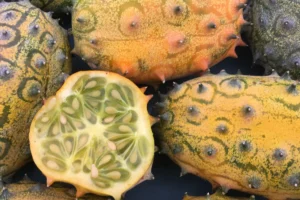 Close up on several melons with one cut in half.